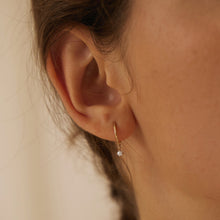 Load image into Gallery viewer, HELENA | Single White Pearl Dangle Huggie Hoop Hoops & Huggies AURELIE GI