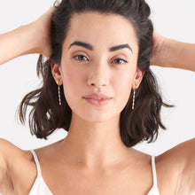 Load image into Gallery viewer, Gold Glow Drop Huggie Hoops