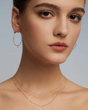 Load image into Gallery viewer, CHASSE | Pear Shape Floating Diamond Necklace by Aurelie Gi — on model
