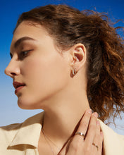 Load image into Gallery viewer, DICARRO | Two-Tone Geometric Huggie Earring by Aurelie Gi — on model
