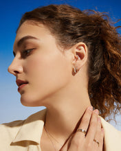 Load image into Gallery viewer, GILEA | Two-Tone Pavé Lab Grown Diamond Huggie by Aurelie Gi — on model
