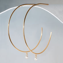 Load image into Gallery viewer, PIROUETTE | Single Floating Diamond Hoop Earrings by Aurelie Gi — on model
