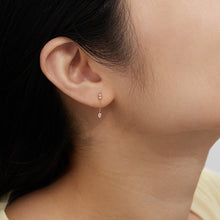 Load image into Gallery viewer, DEWDROP | Pear and Round White Sapphire Drop Stud Earring by Aurelie Gi — on model
