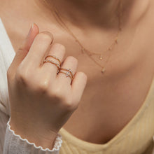 Load image into Gallery viewer, GLENNA | Pear and Round White Sapphire Half-Eternity Ring by Aurelie Gi — on model

