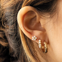 Load image into Gallery viewer, Gold tasha earrings on model
